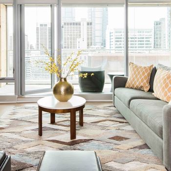 Furnished living room with glass doors leading to an outdoor terrace